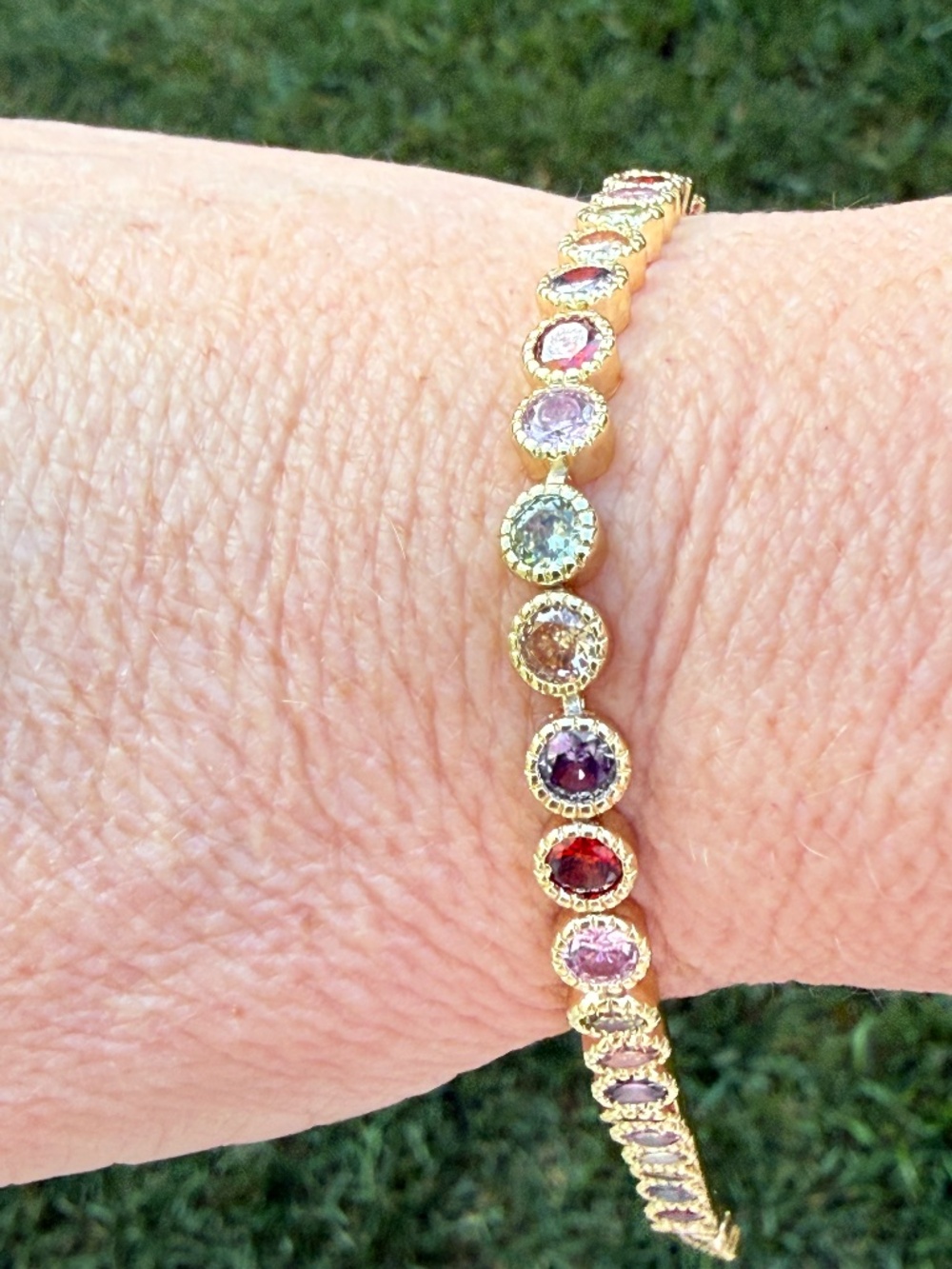 Gold tennis braclet with colored gemstones